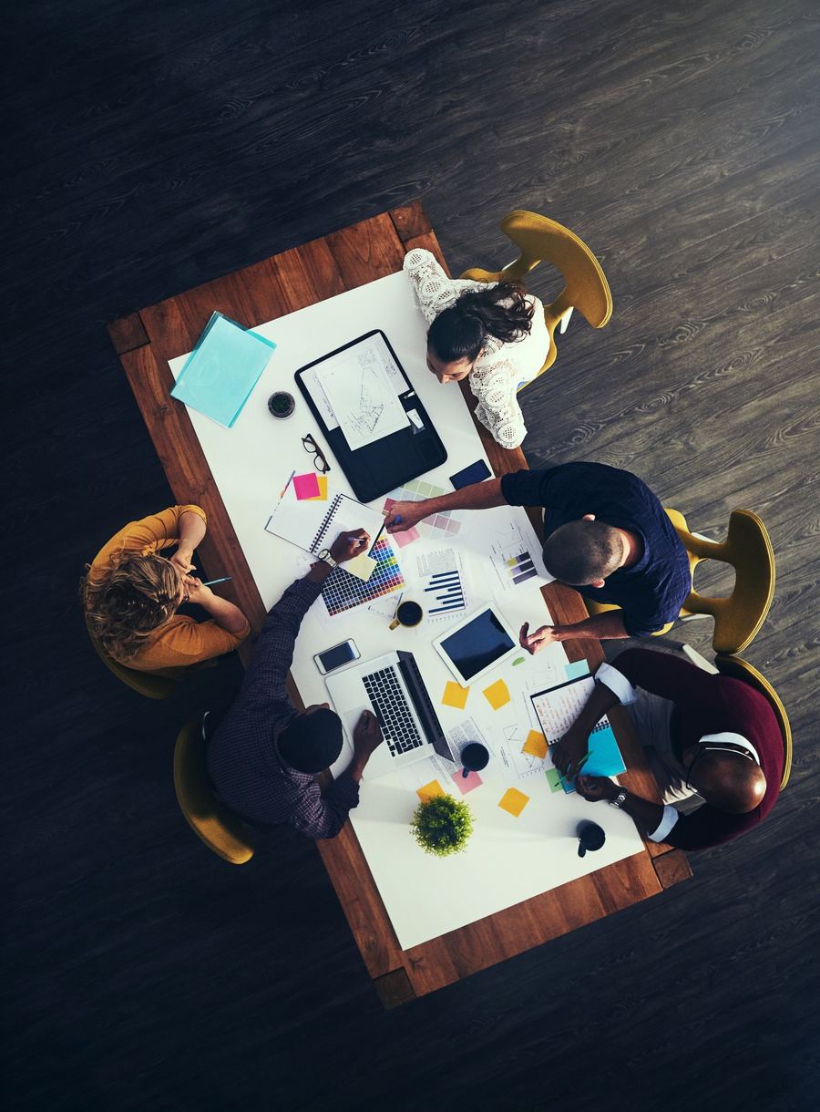 A team working through a plan around a table